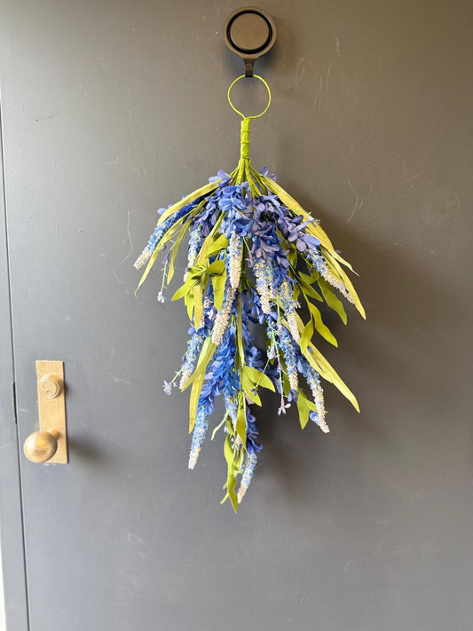Blue wisteria cascading door swag on gray door