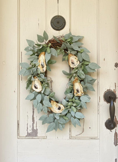 Gold rimmed oyster shell wreath coastal glam