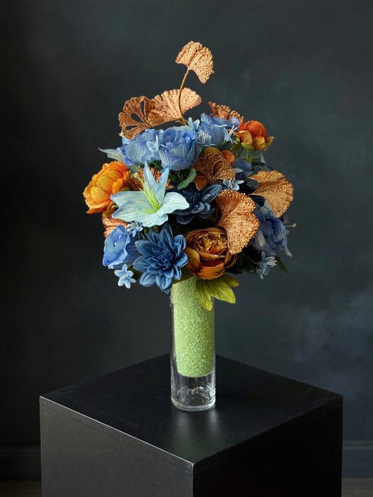 Blue and copper cemetery urn arrangement with ginkgo leaves