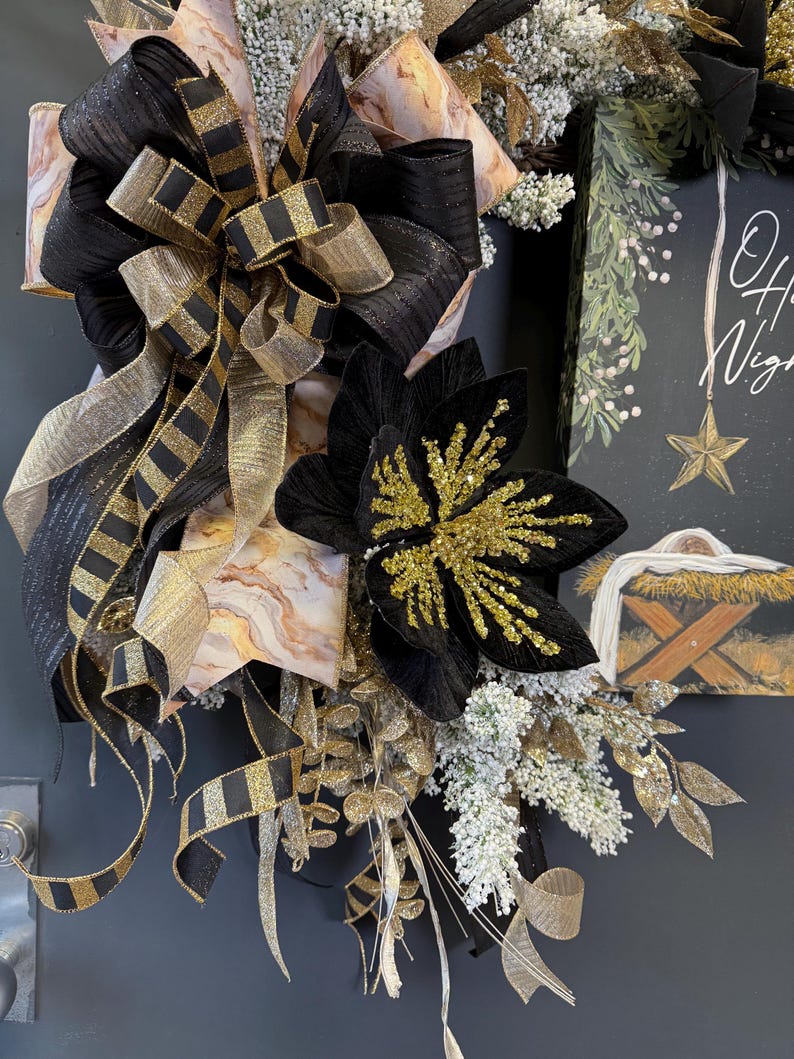 Nativity wreath black gold ribbon white floral