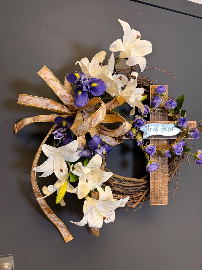 Easter cross wreath white lilies purple irises wooden cross detail
