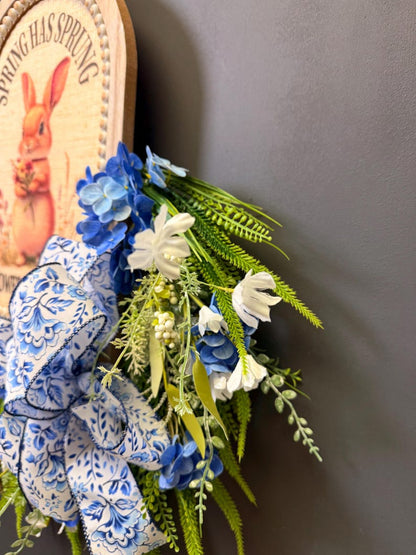 Blue chinoiserie bunny door hanger with blue and white bow