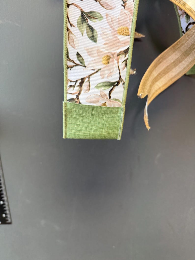 Magnolia floral ribbon sage green gold edge detail
