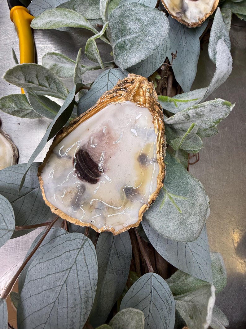 Gold rimmed oyster shell detail sage green leaves