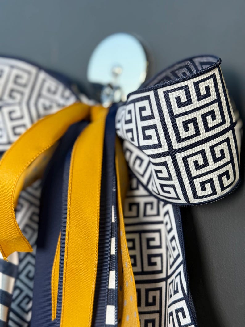 Navy gold bow Greek key mustard grosgrain detail