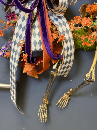 Gold skeleton wreath harlequin bow purple velvet