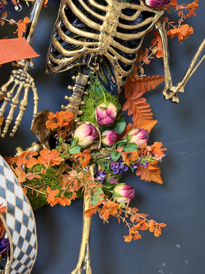 Gold skeleton torso moss orange foliage elegant spooky